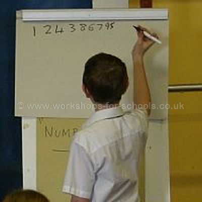 Boy writing out a string of numbers