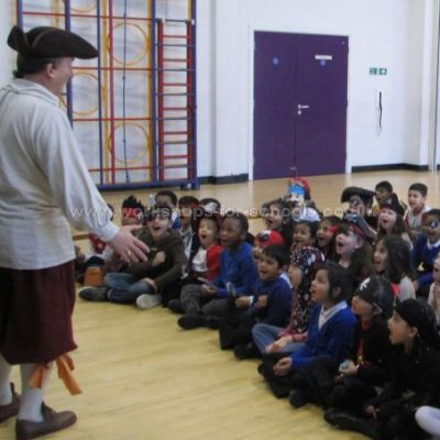 Pirate Ron talking to a group of sixty children