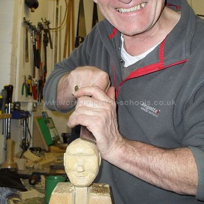 Ron carving a puppet