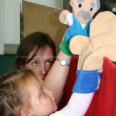 Girl working glove puppets